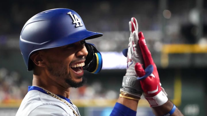 Los Angeles Dodgers shortstop Mookie Betts (50) celebrates after hitting a solo home run against the Arizona Diamondbacks during the first inning at Chase Field on Aug 31.