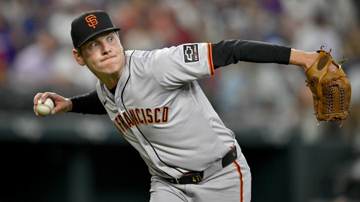 Jun 8, 2024; Arlington, Texas, USA; San Francisco Giants starting pitcher Spencer Howard (56) tries but cannot throw out Texas Rangers catcher Andrew Knizner (12) (not pictured) at first base during the fifth inning at Globe Life Field. 