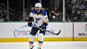 Dec 14, 2024; Dallas, Texas, USA; St. Louis Blues defenseman Pierre-Olivier Joseph (77) in action during the game between the Dallas Stars and the St. Louis Blues at American Airlines Center. Mandatory Credit: Jerome Miron-Imagn Images