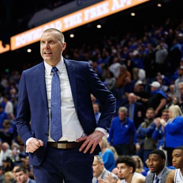 Jan 14, 2025; Lexington, Kentucky, USA; Kentucky Wildcats head coach Mark Pope talks with guard Otega Oweh (00) during the second half against the Texas A&M Aggies at Rupp Arena at Central Bank Center. Mandatory Credit: Jordan Prather-Imagn Images
