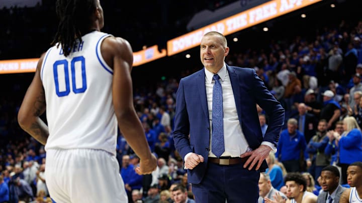Jan 14, 2025; Lexington, Kentucky, USA; Kentucky Wildcats head coach Mark Pope talks with guard Otega Oweh (00) during the second half against the Texas A&M Aggies at Rupp Arena at Central Bank Center. Mandatory Credit: Jordan Prather-Imagn Images