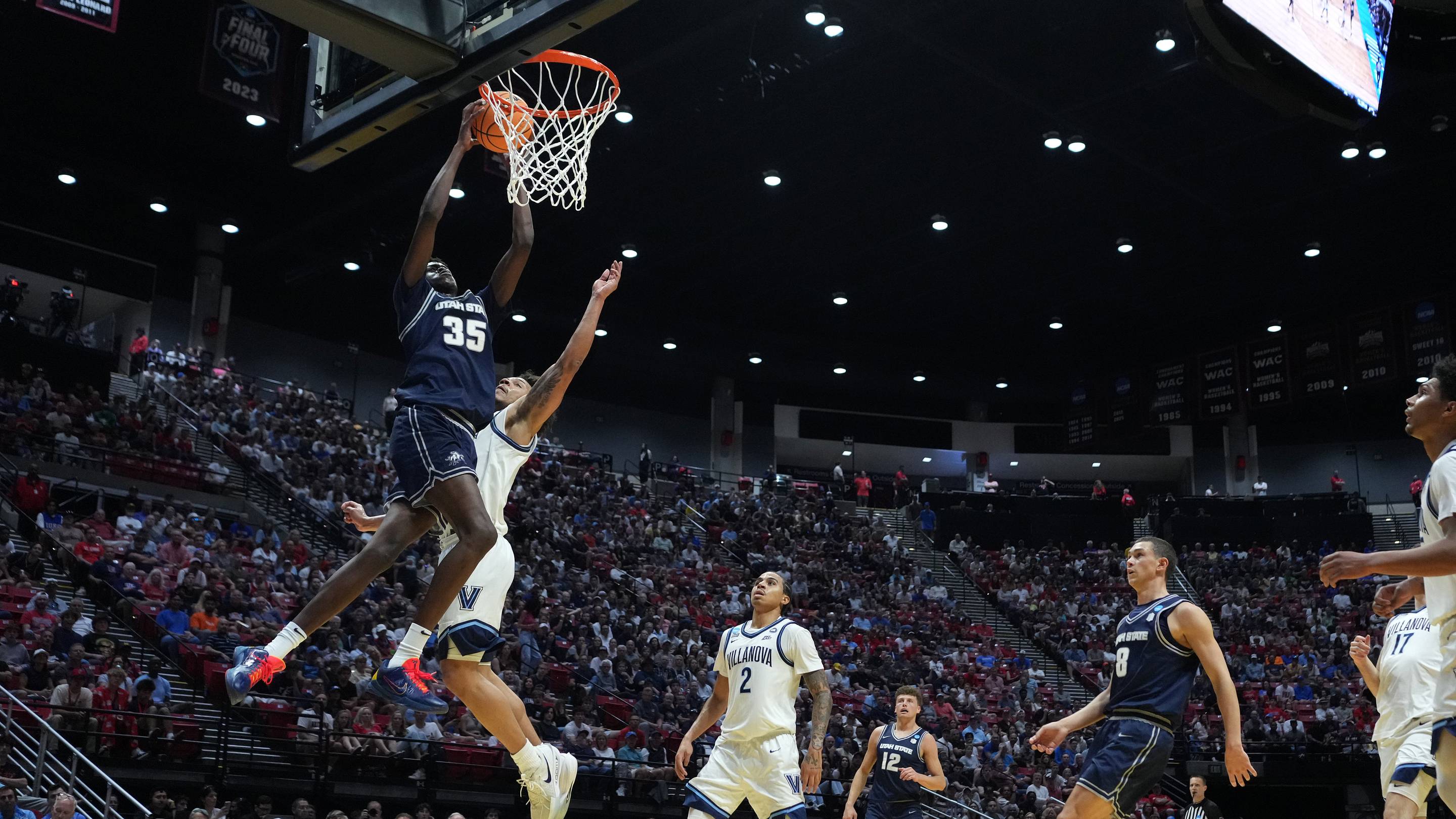 Mar 20, 2026; San Diego, CA, USA; Utah State Aggies forward Adlan Elamin (35) shoots against Villanova Wildcats guard Tyler Perkins (4) in the first half during a first round game of the men's 2026 NCAA Tournament at Viejas Arena. Mandatory Credit: Kirby Lee-Imagn Images | IMAGN IMAGES via Reuters C