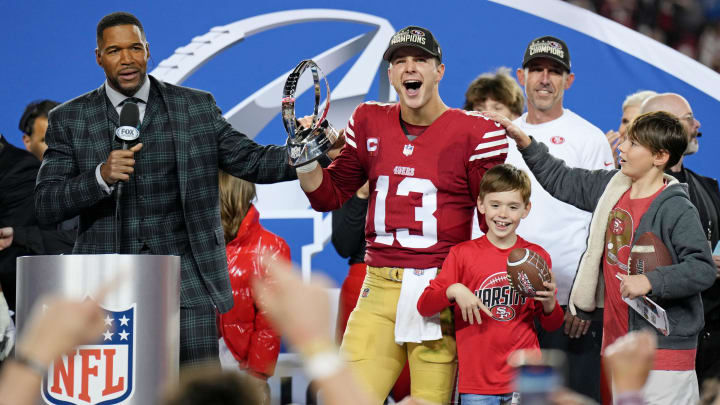 Jan 28, 2024; Santa Clara, California, USA; San Francisco 49ers quarterback Brock Purdy (13) celebrates with the George Halas Trophy after winning the NFC Championship football game against the Detroit Lions at Levi's Stadium. Mandatory Credit: Kyle Terada-USA TODAY Sports