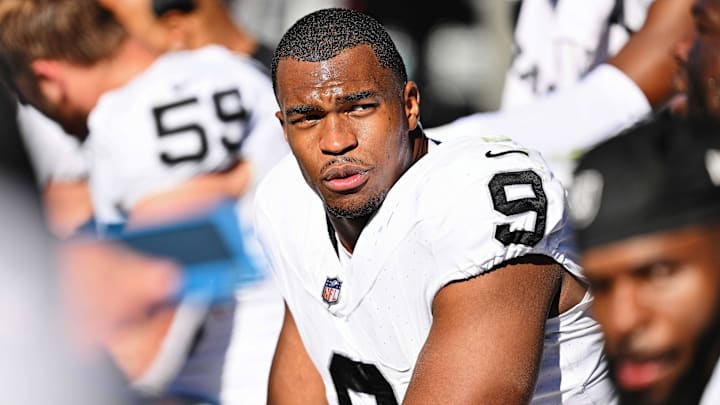 Oct 22, 2023; Chicago, Illinois, USA;  Las Vegas Raiders defensive end Tyree Wilson (9) takes a breather on the sidelines against the Chicago Bears at Soldier Field. Mandatory Credit: Jamie Sabau-Imagn Images