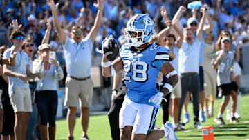 Oct 12, 2024; Chapel Hill, North Carolina, USA; North Carolina Tar Heels running back  (28) runs for a touchdown in the third quarter at Kenan Memorial Stadium. Mandatory Credit: Bob Donnan-Imagn Images