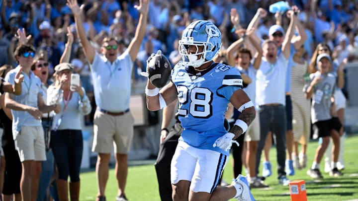 Oct 12, 2024; Chapel Hill, North Carolina, USA; North Carolina Tar Heels running back  (28) runs for a touchdown in the third quarter at Kenan Memorial Stadium. Mandatory Credit: Bob Donnan-Imagn Images