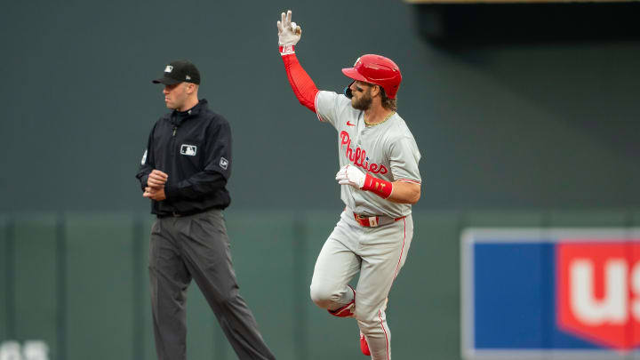 Jul 22, 2024; Minneapolis, Minnesota, USA; Philadelphia Phillies first baseman Bryce Harper (3) celebrates hitting a two run home run against the Minnesota Twins in the first inning at Target Field.