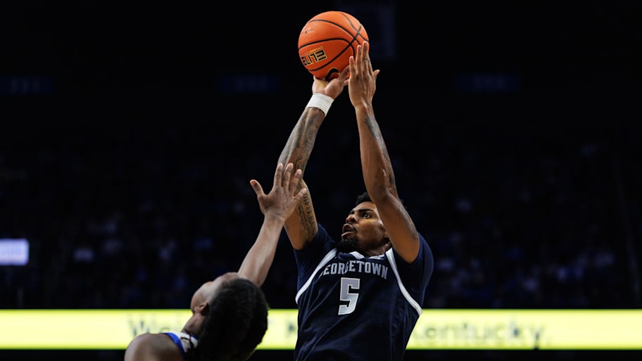 Georgetown guard KJ Lewis shoots the ball against Kentucky.