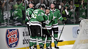 May 13, 2025; Dallas, Texas, USA; Dallas Stars right wing Mikko Rantanen (96) and center Roope Hintz (24) and center Mikael Granlund (64) and defenseman Thomas Harley (55) celebrates a goal scored by Granlund against the Winnipeg Jets during the second period in game four of the second round of the 2025 Stanley Cup Playoffs at American Airlines Center. Mandatory Credit: Jerome Miron-Imagn Images