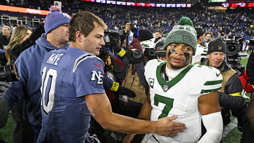 Nov 13, 2025; Foxborough, Massachusetts, USA; New England Patriots quarterback Drake Maye (10) and New York Jets quarterback Justin Fields (7) react after the game at Gillette Stadium. Mandatory Credit: Eric Canha-Imagn Images