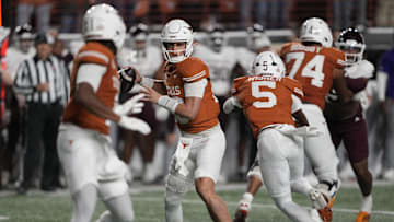 Texas Longhorns quarterback Arch Manning throws a pass during the first half against the Texas A&M Aggies at Darrell K Royal-Texas Memorial Stadium.