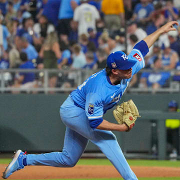 Jul 26, 2025; Kansas City, Missouri, USA; Kansas City Royals relief pitcher Sam Long (73) delivers a pitch against the Cleveland Guardians in the ninth inning at Kauffman Stadium. Mandatory Credit: Denny Medley-Imagn Images