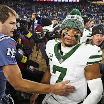 Nov 13, 2025; Foxborough, Massachusetts, USA; New England Patriots quarterback Drake Maye (10) and New York Jets quarterback Justin Fields (7) react after the game at Gillette Stadium. Mandatory Credit: Eric Canha-Imagn Images