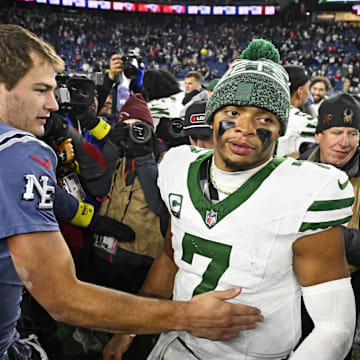 Nov 13, 2025; Foxborough, Massachusetts, USA; New England Patriots quarterback Drake Maye (10) and New York Jets quarterback Justin Fields (7) react after the game at Gillette Stadium. Mandatory Credit: Eric Canha-Imagn Images
