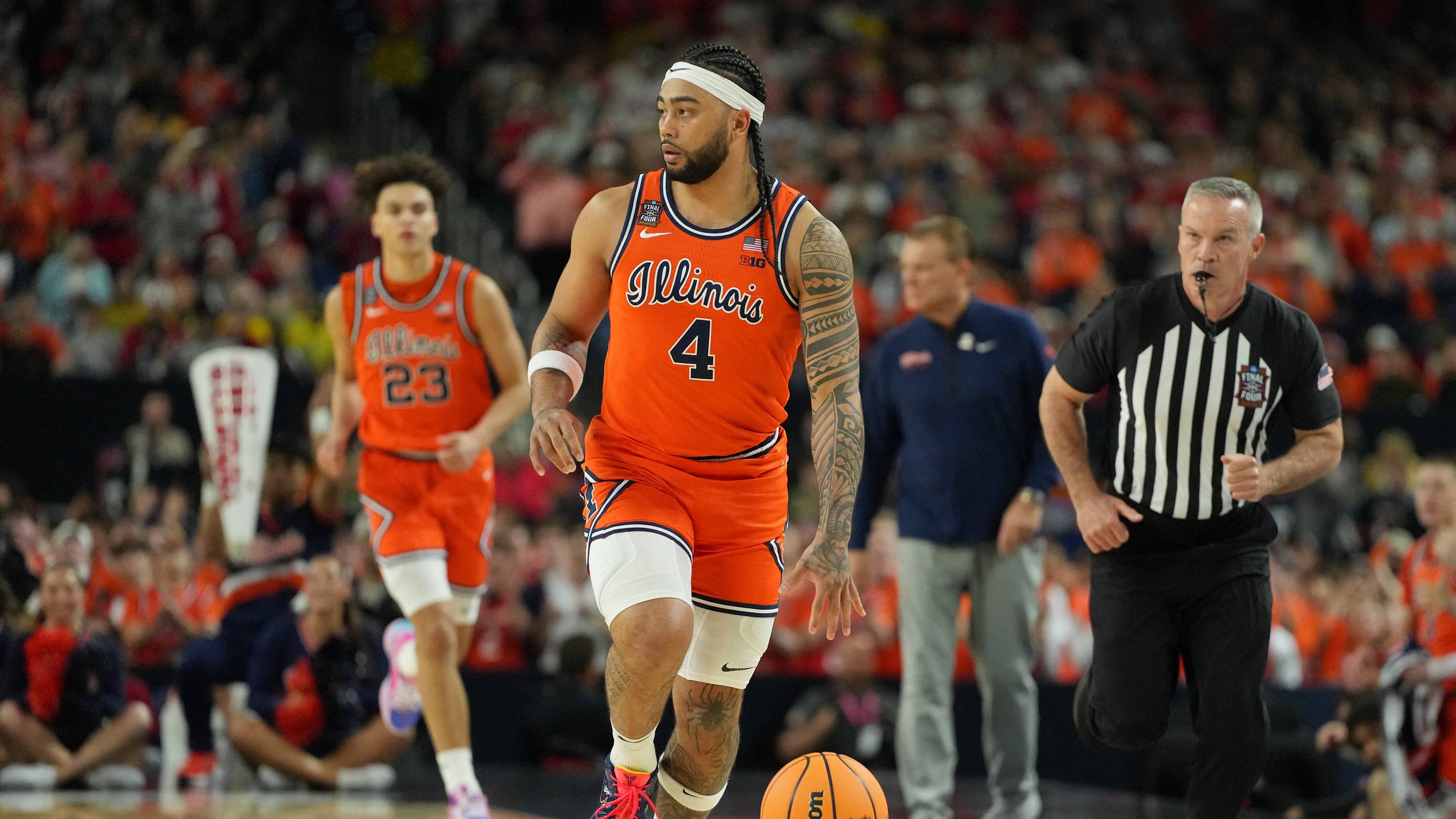 Apr 4, 2026; Indianapolis, IN, USA; Illinois Fighting Illini guard Kylan Boswell (4) dribbles the ball against the UConn Huskies during the first half of a semifinal of the Final Four of the men's 2026 NCAA Tournament at Lucas Oil Stadium. Mandatory Credit: Bob Donnan-Imagn Images