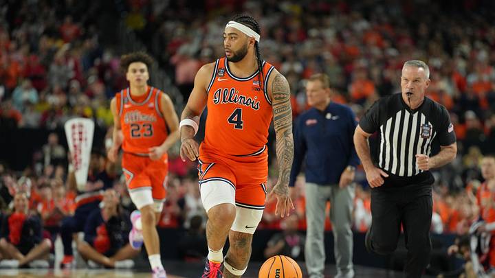 Apr 4, 2026; Indianapolis, IN, USA; Illinois Fighting Illini guard Kylan Boswell (4) dribbles the ball against the UConn Huskies during the first half of a semifinal of the Final Four of the men's 2026 NCAA Tournament at Lucas Oil Stadium. Mandatory Credit: Bob Donnan-Imagn Images