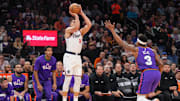 Mar 4, 2025; Phoenix, Arizona, USA; LA Clippers guard Bogdan Bogdanovic (10) shoots against Phoenix Suns guard Bradley Beal (3) during the first half at PHX Center. Mandatory Credit: Joe Camporeale-Imagn Images