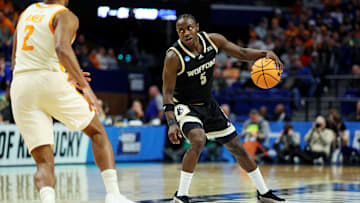 Mar 20, 2025; Lexington, KY, USA; Wofford Terriers guard Justin Bailey (5) handles the ball against Tennessee Volunteers guard Chaz Lanier (2) f2h in the first round of the NCAA Tournament at Rupp Arena. Mandatory Credit: Jordan Prather-Imagn Images