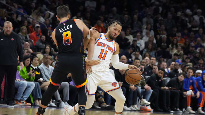 Dec 15, 2023; Phoenix, Arizona, USA; New York Knicks guard Jalen Brunson (11) drives on Phoenix Suns guard Grayson Allen (8) in the second half at Footprint Center. Mandatory Credit: Rick Scuteri-USA TODAY Sports