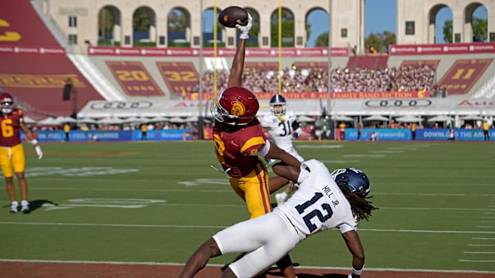 Sep 6, 2025; Los Angeles, California, USA;  USC Trojans wide receiver Ja'Kobi Lane (8) makes a one handed catch for a touchdown as he is defended by Georgia Southern Eagles defensive back Tracy Hill Jr. (12) during the first quarter at United Airlines Field at Los Angeles Memorial Coliseum. Mandatory Credit: Jayne Kamin-Oncea-Imagn Images