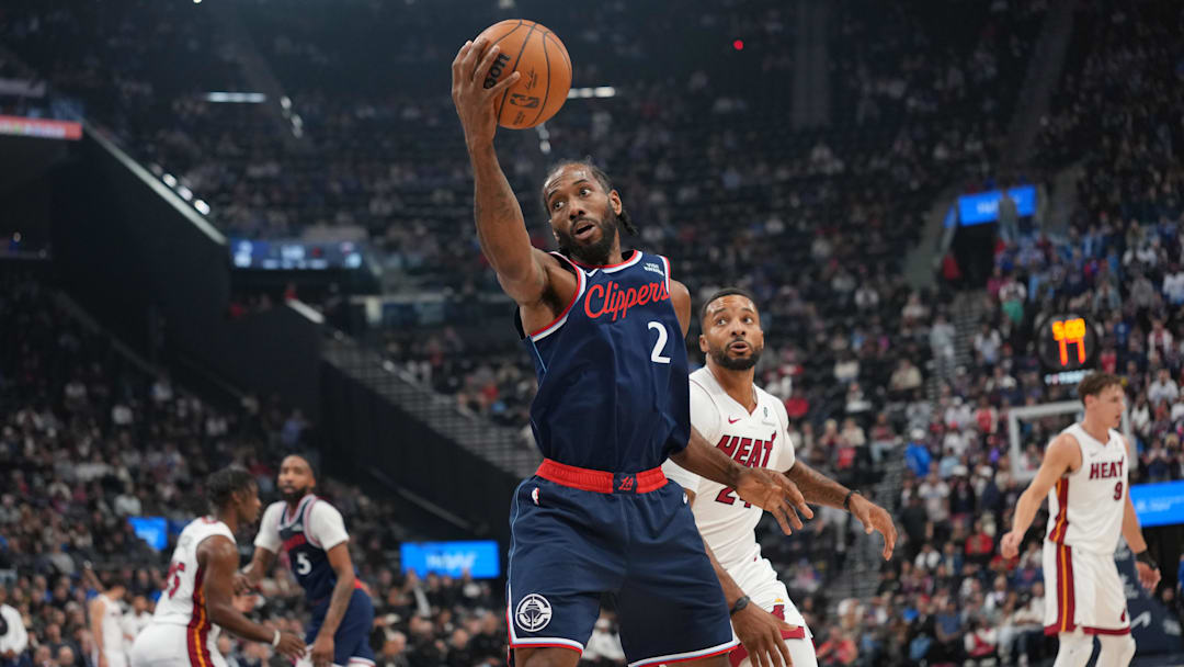 Nov 3, 2025; Inglewood, California, USA; LA Clippers forward Kawhi Leonard (2) reaches for the ball against Miami Heat guard Norman Powell (24) in the first half at Intuit Dome. Mandatory Credit: Kirby Lee-Imagn Images Nov 3, 2025; Inglewood, California, USA; LA Clippers forward Kawhi Leonard (2) reaches for the ball against Miami Heat guard Norman Powell (24) in the first half at Intuit Dome. Mandatory Credit: Kirby Lee-Imagn Images