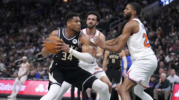 Mar 28, 2025; Milwaukee, Wisconsin, USA; Milwaukee Bucks forward Giannis Antetokounmpo (34) puts up a shot against New York Knicks guard Landry Shamet (44) and New York Knicks forward Mikal Bridges (25) in the first half at Fiserv Forum. Mandatory Credit: Michael McLoone-Imagn Images Mar 28, 2025; Milwaukee, Wisconsin, USA; Milwaukee Bucks forward Giannis Antetokounmpo (34) puts up a shot against New York Knicks guard Landry Shamet (44) and New York Knicks forward Mikal Bridges (25) in the first half at Fiserv Forum. Mandatory Credit: Michael McLoone-Imagn Images