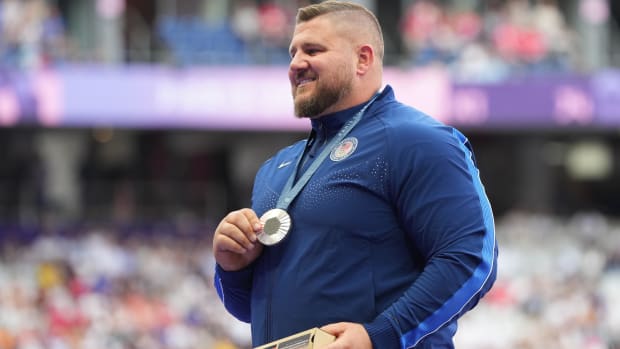 Joe Kovacs of the U.S. holds his silver medal in the shot put at the 2024 Paris Olympics.