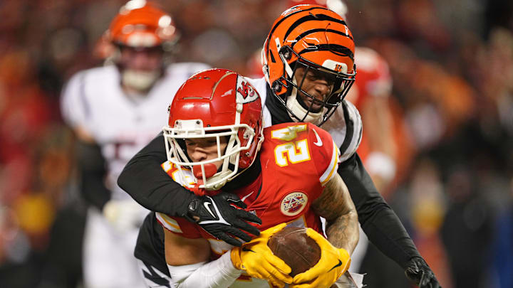 Jan 29, 2023; Kansas City, Missouri, USA; Kansas City Chiefs wide receiver Skyy Moore (24) runs with the ball against Cincinnati Bengals cornerback Eli Apple (20) during the fourth quarter of the AFC Championship game at GEHA Field at Arrowhead Stadium. Mandatory Credit: Jay Biggerstaff-Imagn Images