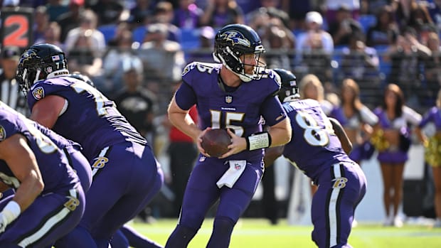 Baltimore Ravens quarterback Cooper Rush looks back to pass during the third quarter against the Houston Texans