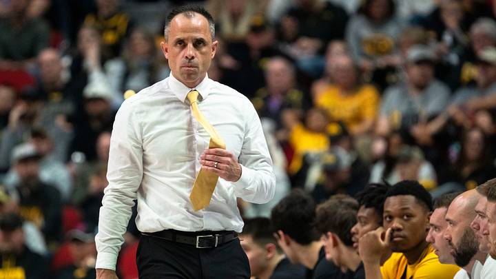 Iowa head coach Ben McCollum walks near the bench during a game at Casey's Center on Saturday, Dec. 20, 2025 in Des Moines.