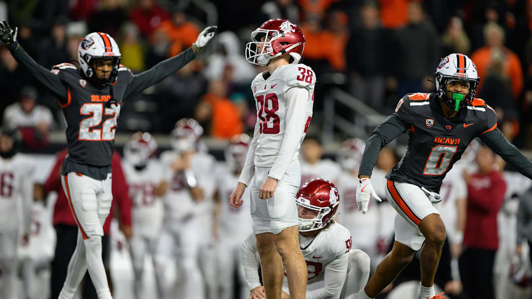 Nov 1, 2025; Corvallis, Oregon, USA; Washington State Cougars kicker Jack Stevens (38) reacts to missing a game tying field goal as Oregon State Beavers defensive back Jalil Tucker (22) celebrates in the background late in the 4th quarter at Reser Stadium. Mandatory Credit: Craig Strobeck-Imagn Images