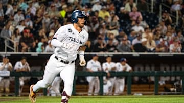 Jun 15, 2024; Omaha, NE, USA; Texas A&M Aggies third baseman Gavin Grahovac (9) runs to first after hitting a single against the Florida Gators during the fourth inning at Charles Schwab Field Omaha. Mandatory Credit: Dylan Widger-USA TODAY Sports