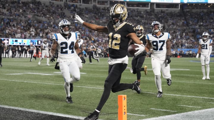 Sep 18, 2023; Charlotte, North Carolina, USA; New Orleans Saints wide receiver Chris Olave (12) crosses the goal line but was ruled to have stepped out of bounds earlier on the play in the fourth quarter at Bank of America Stadium. 