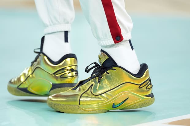 USA forward LeBron James' gold Nike sneakers.