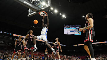 Apr 5, 2025; San Antonio, TX, USA; Duke Blue Devils center Khaman Maluach (9) dunks against the Houston Cougars during the second half in the semifinals of the men's Final Four of the 2025 NCAA Tournament at the Alamodome. Mandatory Credit: Bob Donnan-Imagn Images