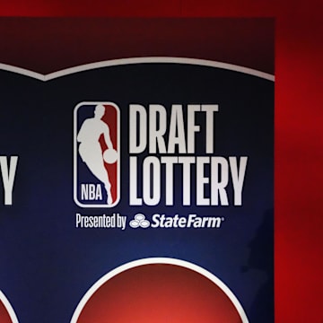 May 12, 2025; Chicago, Illinois, US; A person watches the 2025 NBA Draft Lottery at McCormick Place. Mandatory Credit: David Banks-Imagn Images