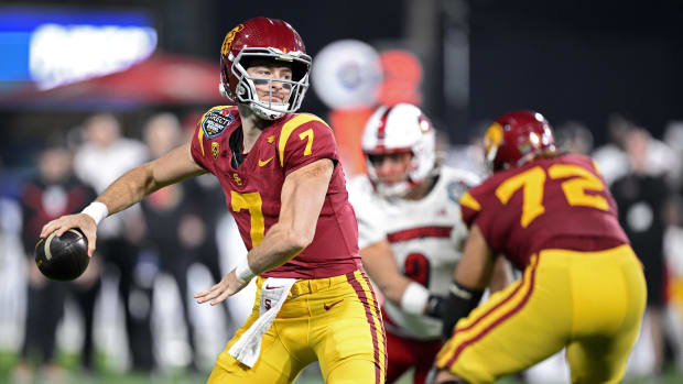 Dec 27, 2023; San Diego, CA, USA; USC Trojans quarterback Miller Moss (7) throws a pass against the Louisville Cardinals duri