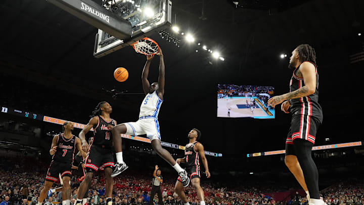 Apr 5, 2025; San Antonio, TX, USA; Duke Blue Devils center Khaman Maluach (9) dunks against the Houston Cougars during the second half in the semifinals of the men's Final Four of the 2025 NCAA Tournament at the Alamodome. Mandatory Credit: Bob Donnan-Imagn Images