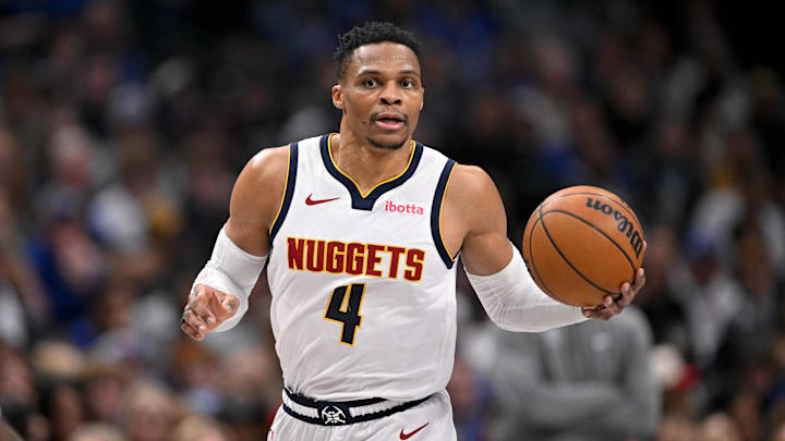 Jan 12, 2025; Dallas, Texas, USA; Denver Nuggets guard Russell Westbrook (4) brings the ball up court against the Dallas Mavericks during the second half at the American Airlines Center. Jan 12, 2025; Dallas, Texas, USA; Denver Nuggets guard Russell Westbrook (4) brings the ball up court against the Dallas Mavericks during the second half at the American Airlines Center.