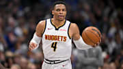 Jan 12, 2025; Dallas, Texas, USA; Denver Nuggets guard Russell Westbrook (4) brings the ball up court against the Dallas Mavericks during the second half at the American Airlines Center. Mandatory Credit: Jerome Miron-Imagn Images