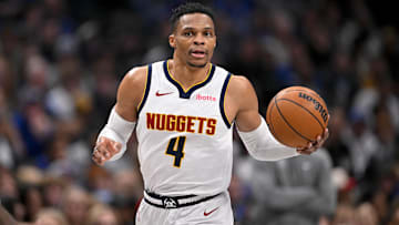 Jan 12, 2025; Dallas, Texas, USA; Denver Nuggets guard Russell Westbrook (4) brings the ball up court against the Dallas Mavericks during the second half at the American Airlines Center. Mandatory Credit: Jerome Miron-Imagn Images