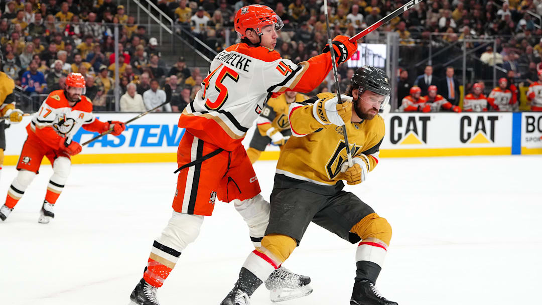 May 4, 2026; Las Vegas, Nevada, USA; Vegas Golden Knights defenseman Rasmus Andersson (4) ducks underneath the follow through of Anaheim Ducks right wing Beckett Sennecke (45) during the second period of game one of the second round of the 2026 Stanley Cup Playoffs at T-Mobile Arena. Mandatory Credit: Stephen R. Sylvanie-Imagn Images
