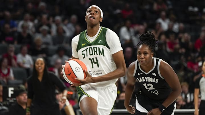 Aug 8, 2025; Las Vegas, Nevada, USA; Seattle Storm center Dominique Malonga (14) attempts to score a layup against Las Vegas Aces guard Chelsea Gray (12) during the second half of a WNBA basketball game at Michelob Ultra Arena. Mandatory Credit: Lucas Peltier-Imagn Images