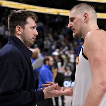 Jan 12, 2025; Dallas, Texas, USA; Dallas Mavericks guard Luka Doncic (left) talks with Denver Nuggets center Nikola Jokic (right) after the game at the American Airlines Center. Mandatory Credit: Jerome Miron-Imagn Images