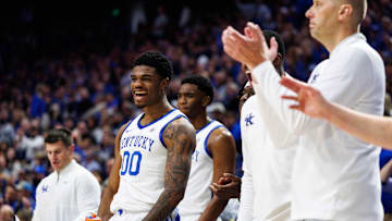 Oct 24, 2025; Lexington, KY, USA; Kentucky Wildcats guard Otega Oweh (00) celebrates from the bench during the first half against the Purdue Boilermakers at Rupp Arena at Central Bank Center. Mandatory Credit: Jordan Prather-Imagn Images