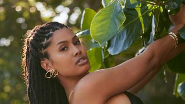 Leyna Bloom was photographed by Amanda Pratt in Dominica. Swimsuit by Norma Kamali. Earrings by Alexis Bittar. Bracelets by Eklexic Jewelry.