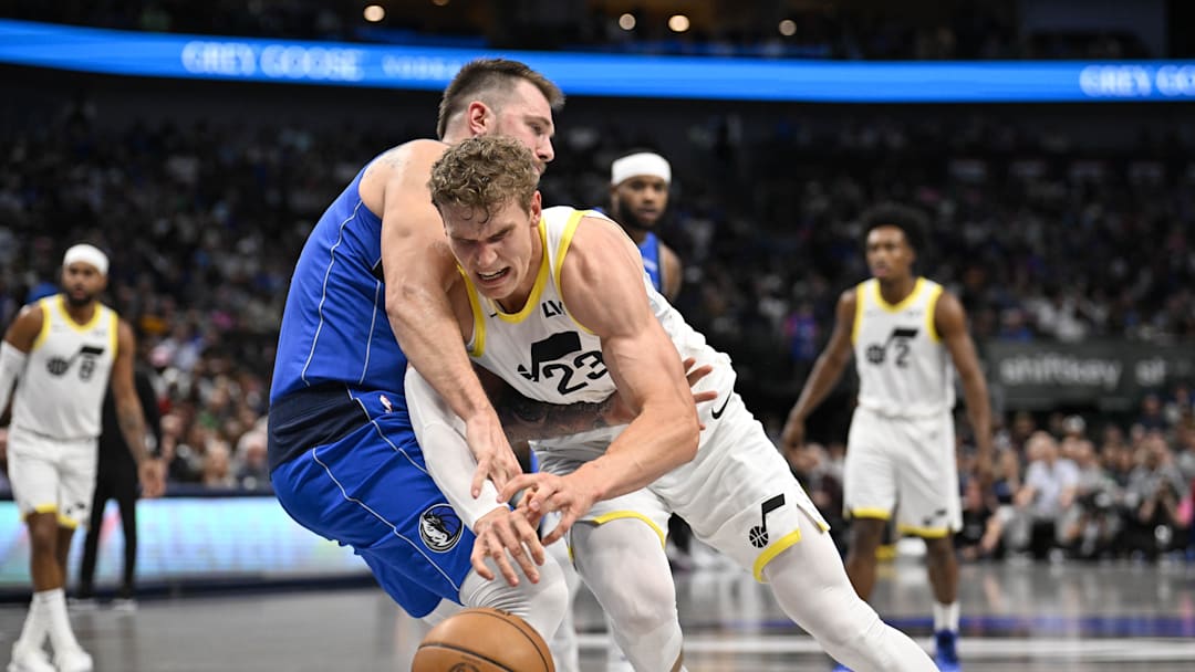 Oct 28, 2024; Dallas, Texas, USA; Dallas Mavericks guard Luka Doncic (77) and Utah Jazz forward Lauri Markkanen (23) in action during the game between the Dallas Mavericks and the Utah Jazz at the American Airlines Center. Mandatory Credit: Jerome Miron-Imagn Images