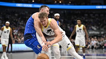 Oct 28, 2024; Dallas, Texas, USA; Dallas Mavericks guard Luka Doncic (77) and Utah Jazz forward Lauri Markkanen (23) in action during the game between the Dallas Mavericks and the Utah Jazz at the American Airlines Center. Mandatory Credit: Jerome Miron-Imagn Images