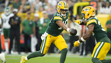 Aug 9, 2025; Green Bay, Wisconsin, USA;  Green Bay Packers quarterback Jordan Love (10) hands off the ball to Green Bay Packers running back Chris Brooks (30) during the first quarter against the New York Jets at Lambeau Field. Mandatory Credit: Kayla Wolf-Imagn Images