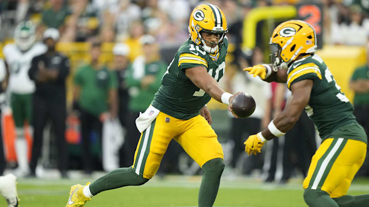 Aug 9, 2025; Green Bay, Wisconsin, USA;  Green Bay Packers quarterback Jordan Love (10) hands off the ball to Green Bay Packers running back Chris Brooks (30) during the first quarter against the New York Jets at Lambeau Field. Mandatory Credit: Kayla Wolf-Imagn Images